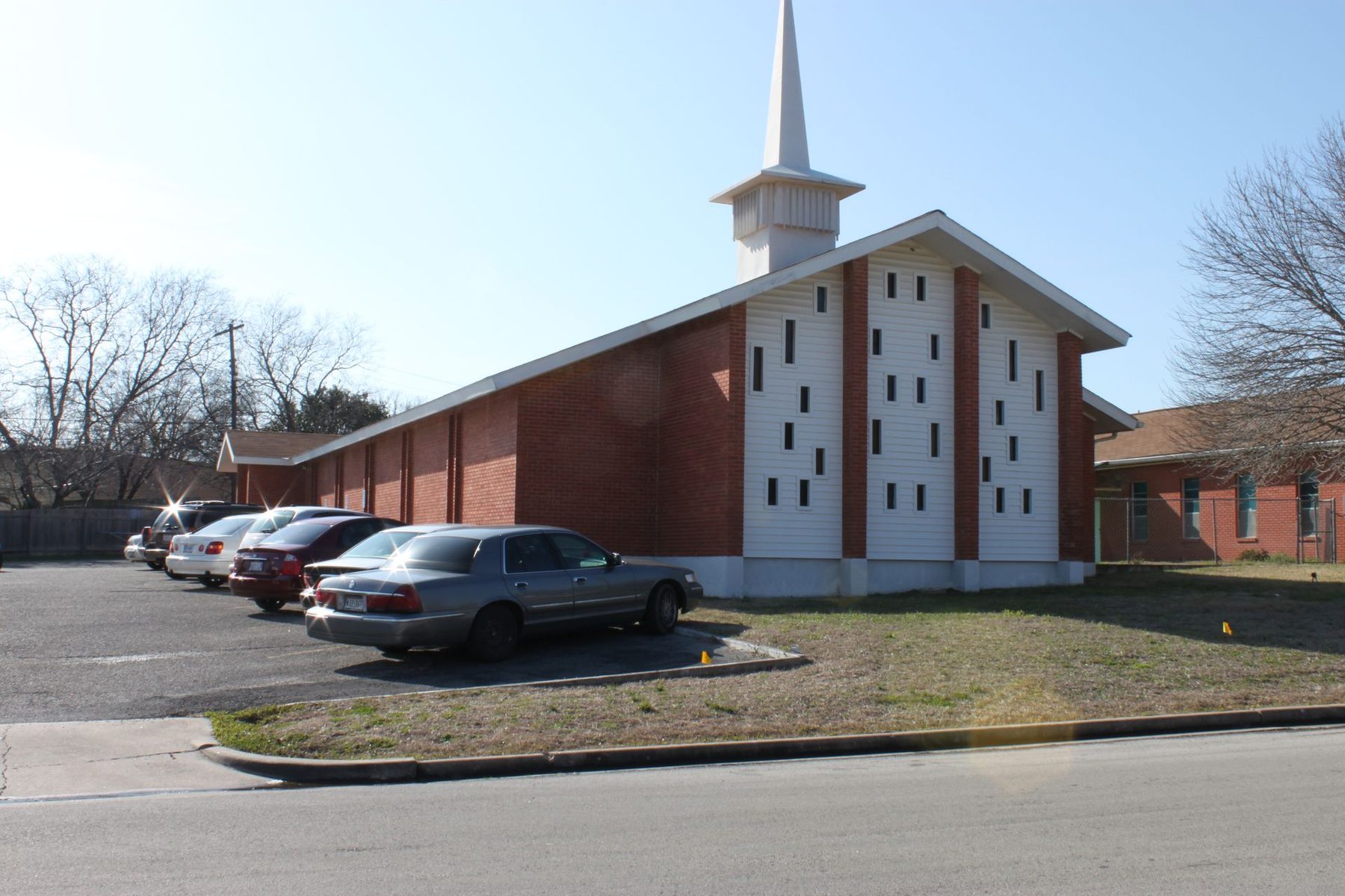 The Greater Union sanctuary: red brick, white slatted facade with slit windows, and a tall white steeple