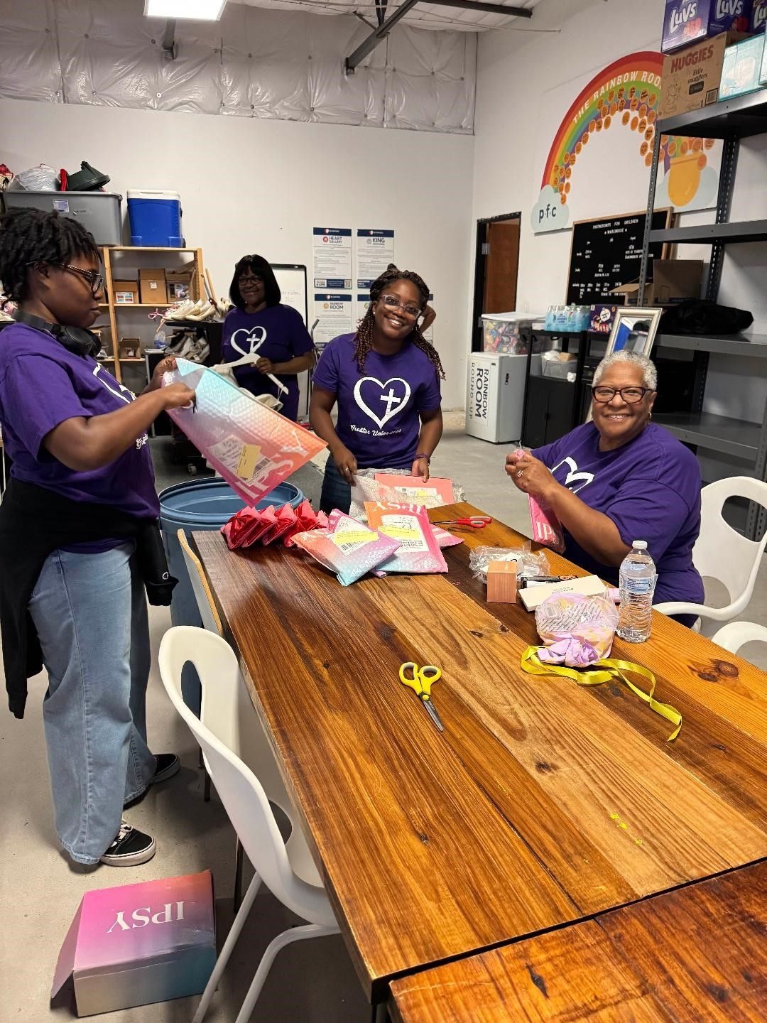 Volunteers at a craft table